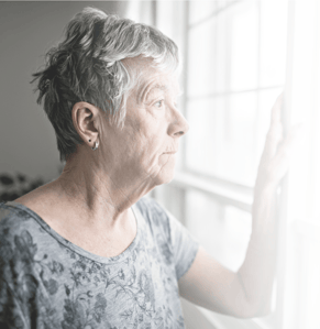Older woman feeling isolated due to hearing loss